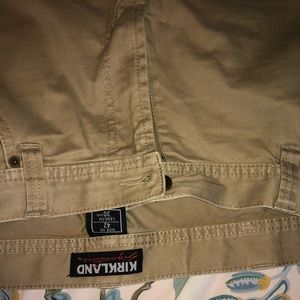 COPY - Men’s light-weight slim flat-front khakis.
